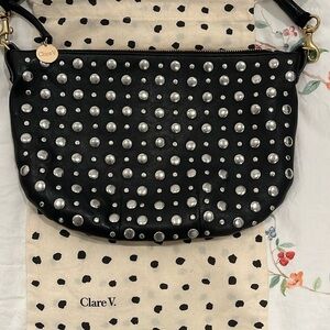 CLARE V. Saddle bag in real leather, black. Like new condition. Used gently.